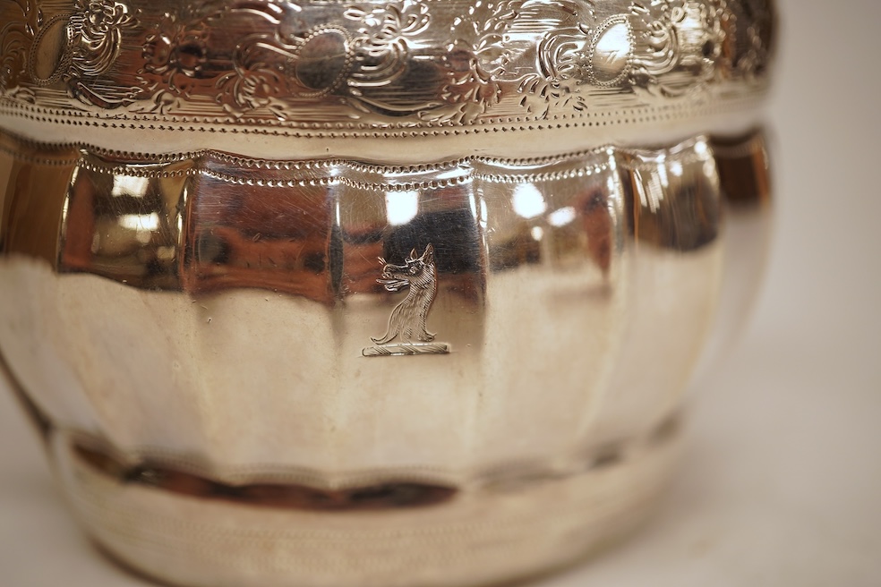 A George III engraved silver helmet shaped cream jug, with fluted body, Soloman Hougham?, London, 1800, height 97mm, 4.5oz (repair).